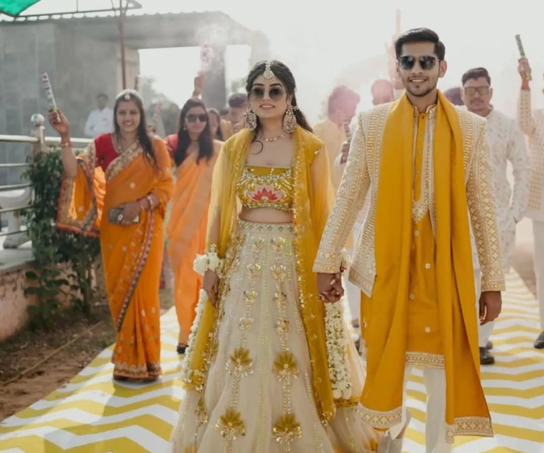 Nothing makes me happier than seeing my clients shine. Here's a beautiful couple in their custom coordinated Haldi outfits, ready to make an entrance. I love creating twinning looks that tell your story together.