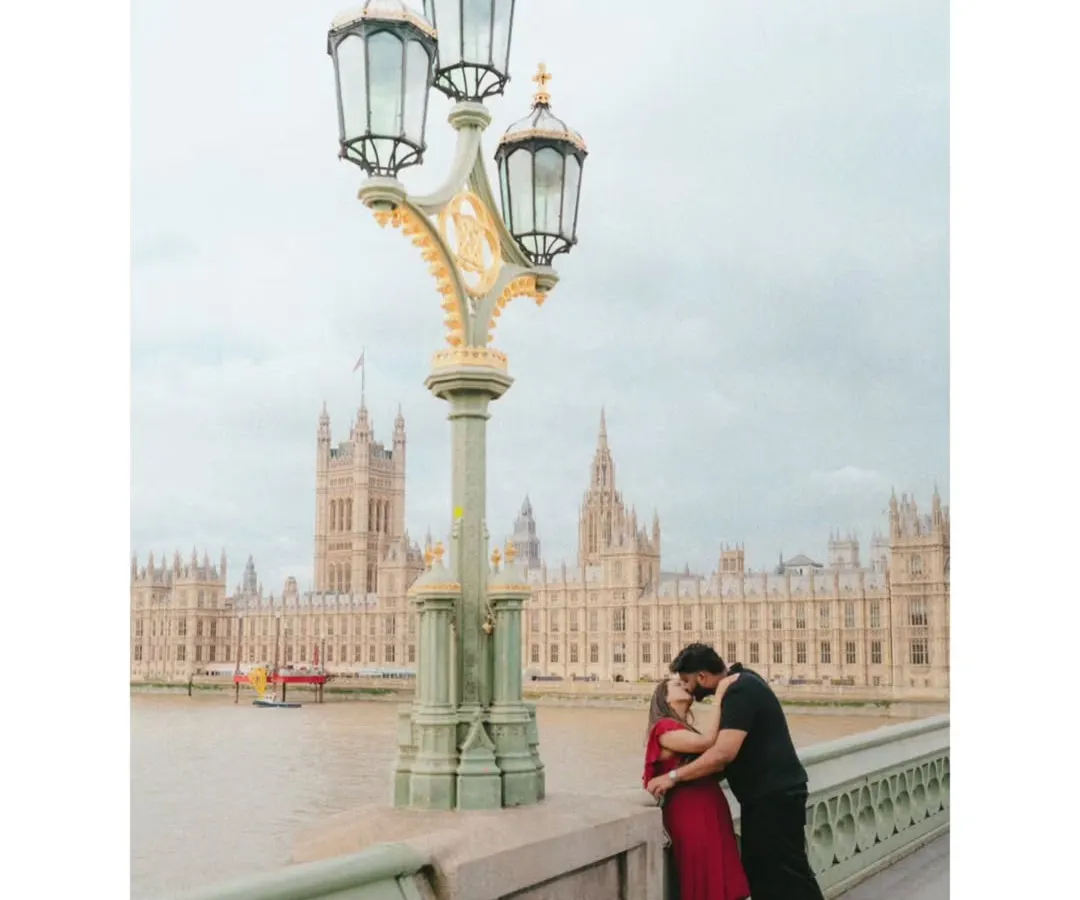 Love stories deserve a grand stage. Here, against the iconic backdrop of London's architecture, Akhil and Merlin share a kiss. This is an example of a destination couple shoot where we use the soul of a city to tell the story of two hearts becoming one.