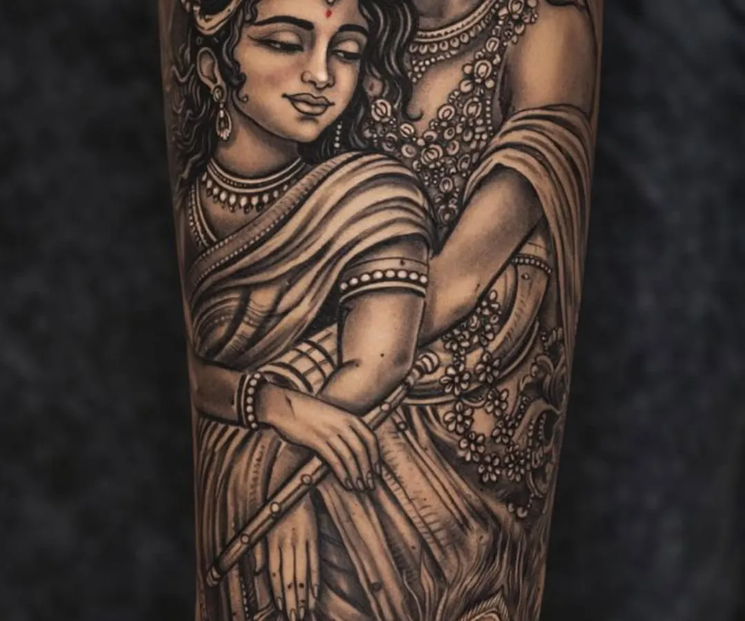 This Radha Krishna tattoo is a story of eternal love, created with immense detail. I've used fine lines and soft shading to capture the divine emotion and connection between them. Look closely at the delicate jewelry, the serene expressions, and the peacock feather, all coming together to create a piece that is truly 'shandaar'.
