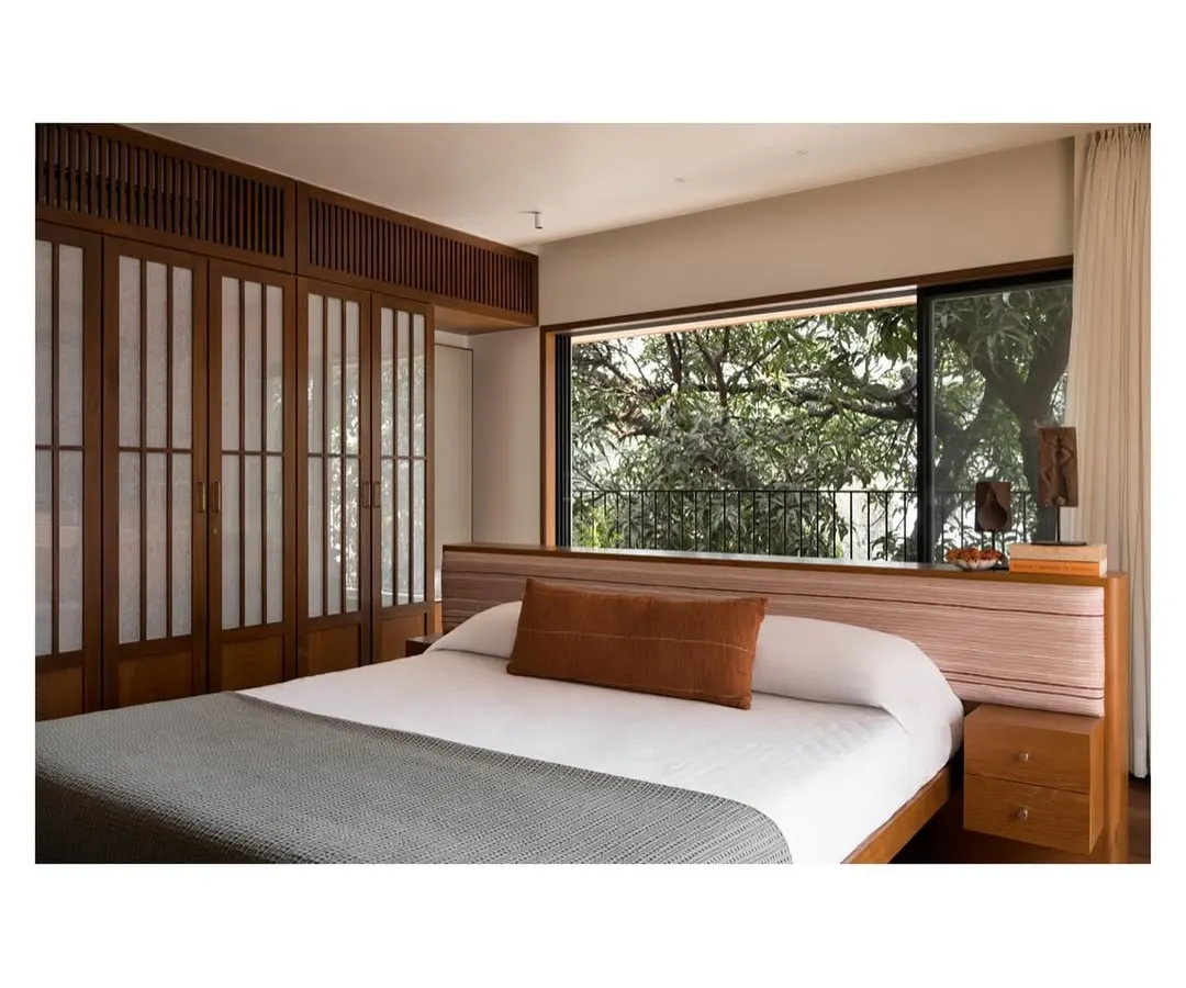 For this master bedroom, I designed a low-profile island bed with an integrated headboard and side tables. The goal was to maintain an uncluttered, zen-like space that feels open and connected to the view, making the room a true sanctuary for rest.