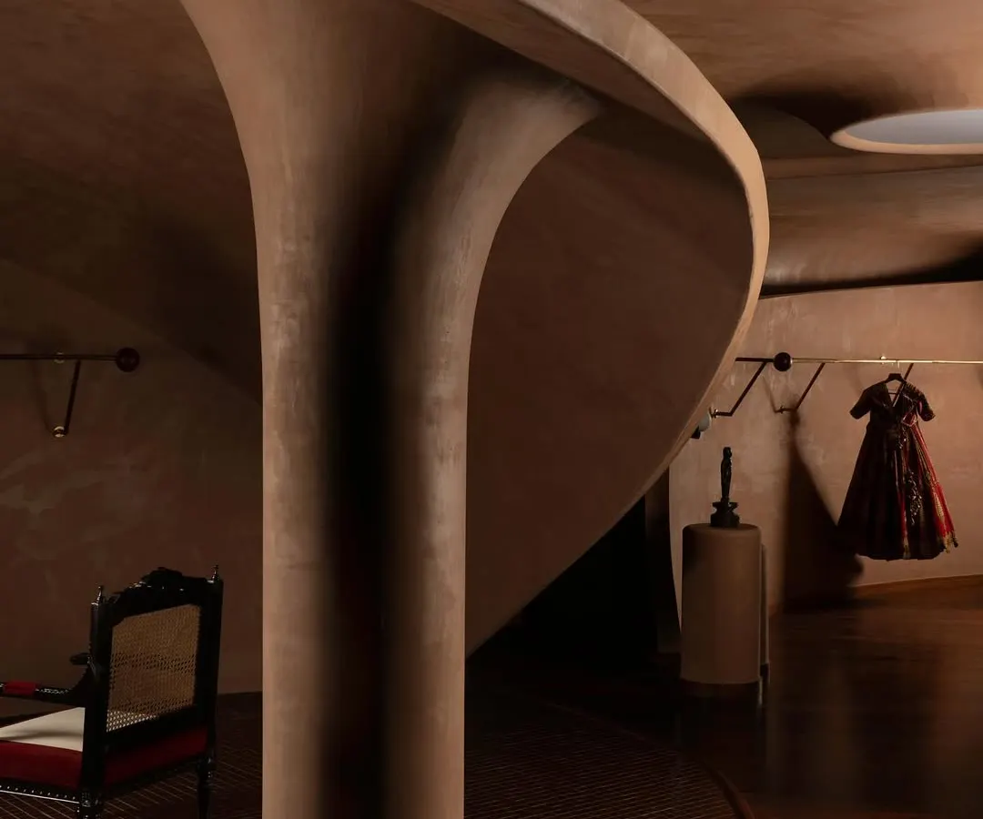 For the House of Masaba flagship, I translated the brand's bold ethos into a sculptural form. The curving, terracotta-hued lime plaster walls evoke the drape of fabric, creating a retail environment that is as much a gallery for fashion as it is a store.