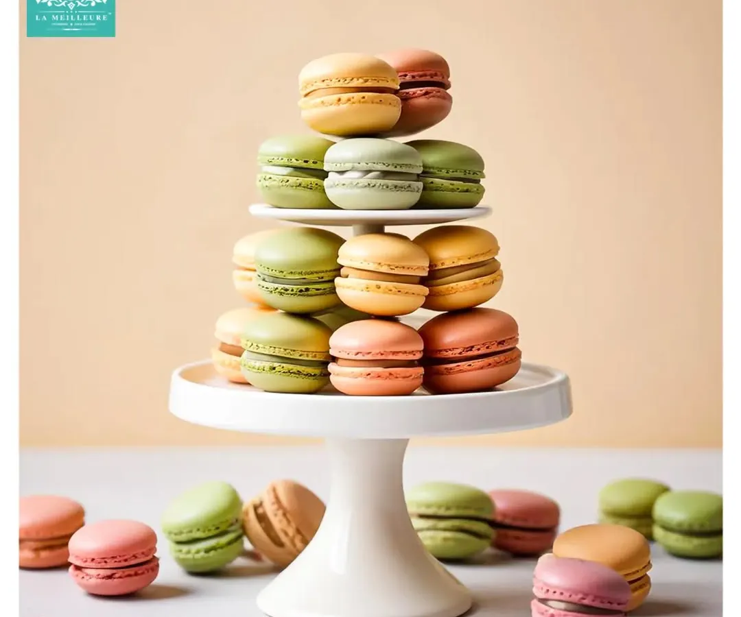 A tower of our classic French macarons, showcasing the vibrant, natural colours and perfectly smooth shells. Each one is a small bite of Parisian heaven, available in a variety of delicate flavours.