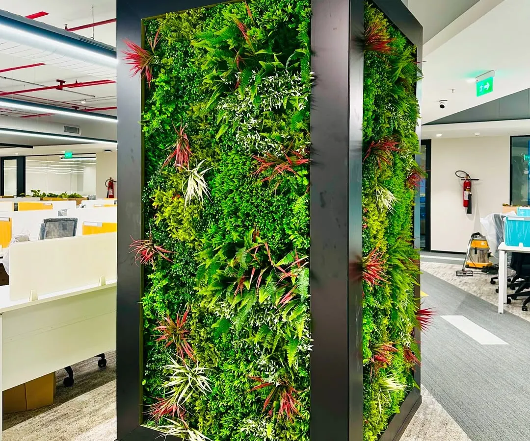 For this corporate office in Hyderabad, I designed and installed a multi-story artificial vertical garden. This green wall acts as a stunning visual centerpiece, improving the office aesthetic and bringing a sense of nature indoors without requiring maintenance like watering or sunlight.