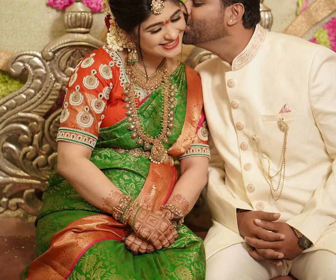 A candid, joyful moment between a couple during their traditional baby shower ceremony. Capturing genuine emotion is at the heart of what I do, preserving these fleeting feelings forever.