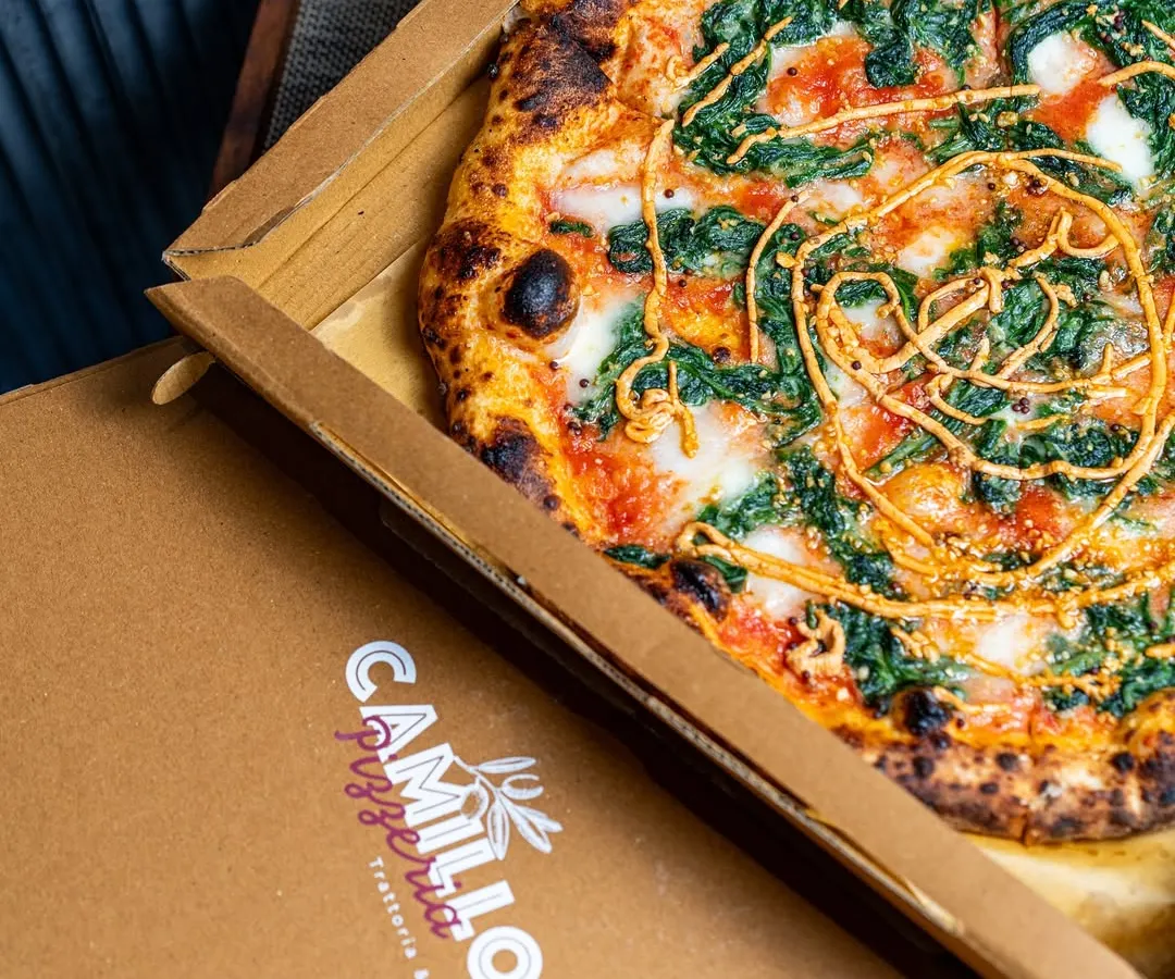 Sometimes the best seat in the house is your own sofa. I box up my pizzas straight from the oven, so you get that fresh, hot, and authentic trattoria experience delivered right to your door. This is comfort food, no fuss involved.