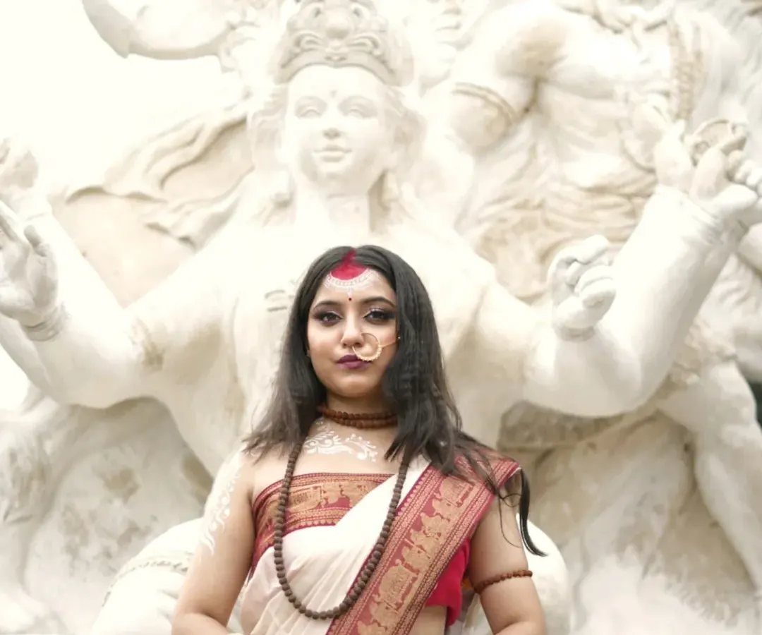 Embodying the divine feminine. This powerful portrait is from a conceptual series inspired by Goddess Parvati, capturing her strength and grace in front of a magnificent sculpture of Lord Shiva.