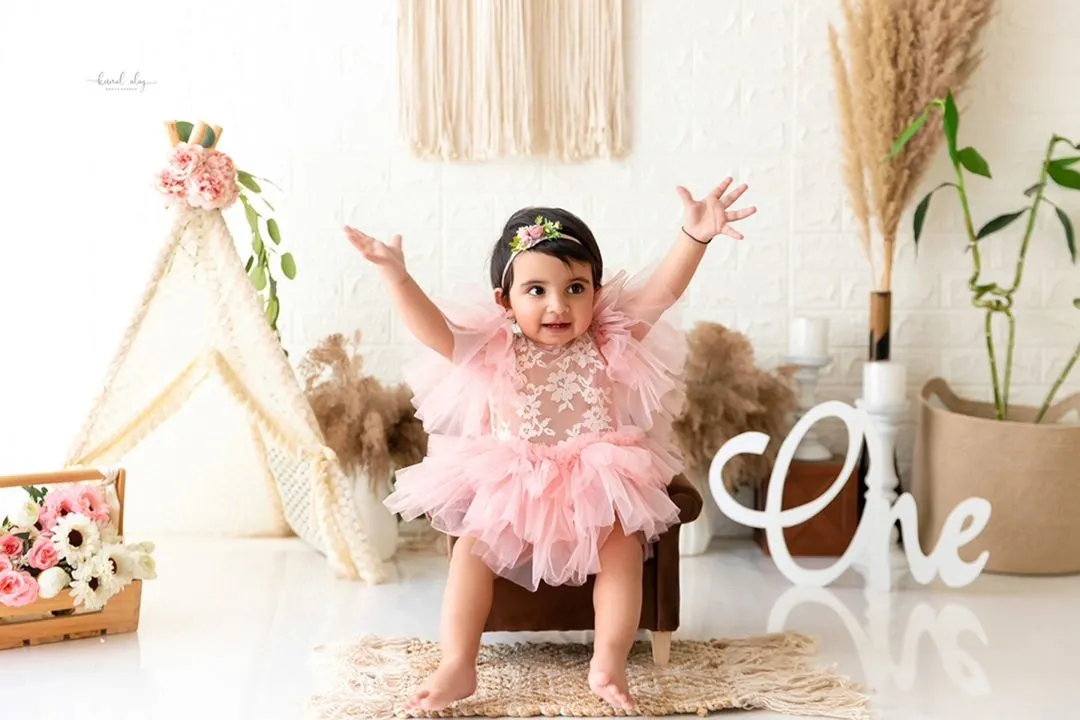 This is a full view of one of my boho-themed studio setups, complete with a teepee and 'ONE' sign, perfect for classic first birthday portraits before the cake comes out.