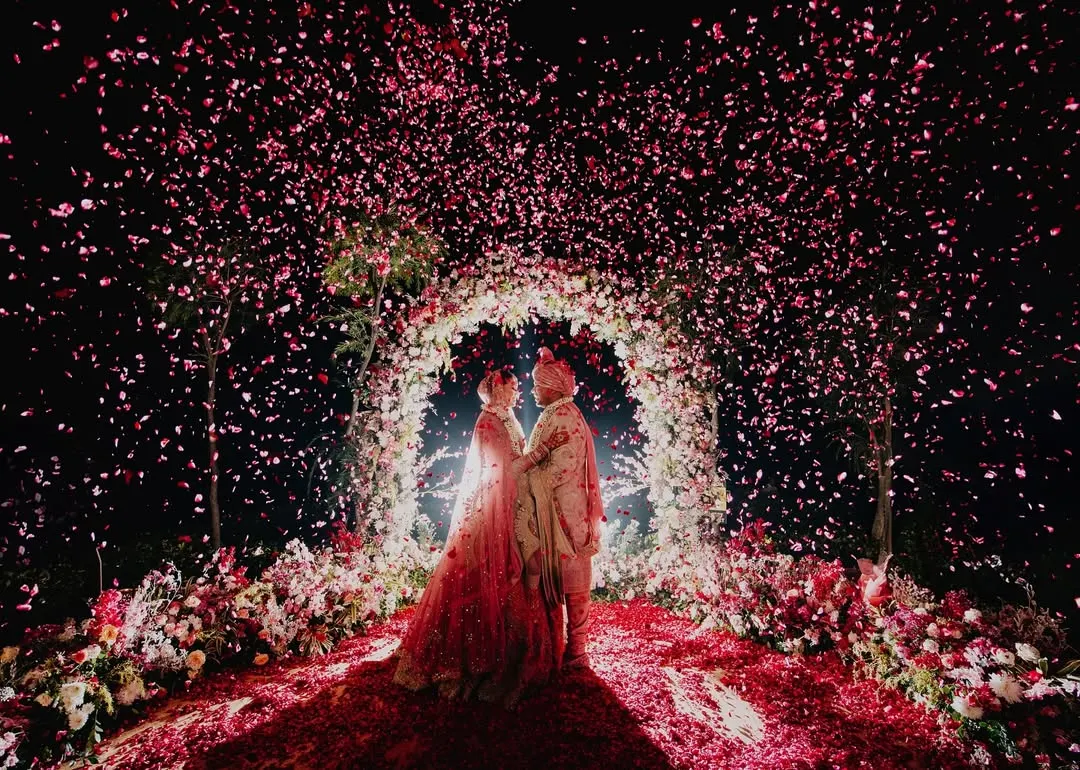 This is the moment it all leads to. We orchestrate these epic, fairytale frames, like this stunning floral shower, to create a memory that feels as grand and magical as the love it celebrates. A perfect shot for a perfect wedding day.