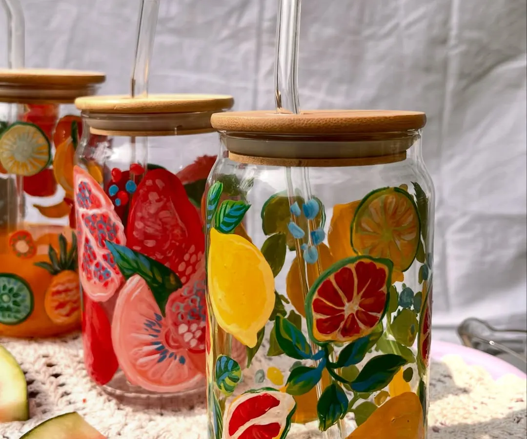 Say hello to our hand-painted summer sipper jars. Each one is painted with bright, fruity designs to make your drinks a little more joyful. These glass tumblers are perfect for everything from iced coffee to fresh juice.
