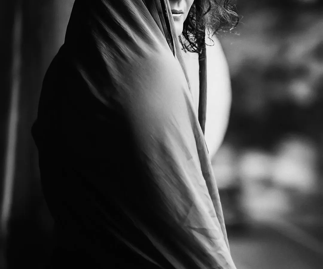 In monochrome, distractions fade away, revealing the soul's true expression. This fine art black and white portrait was created during a quiet, meditative session, allowing the subject's inner world to emerge through a simple, powerful gaze.