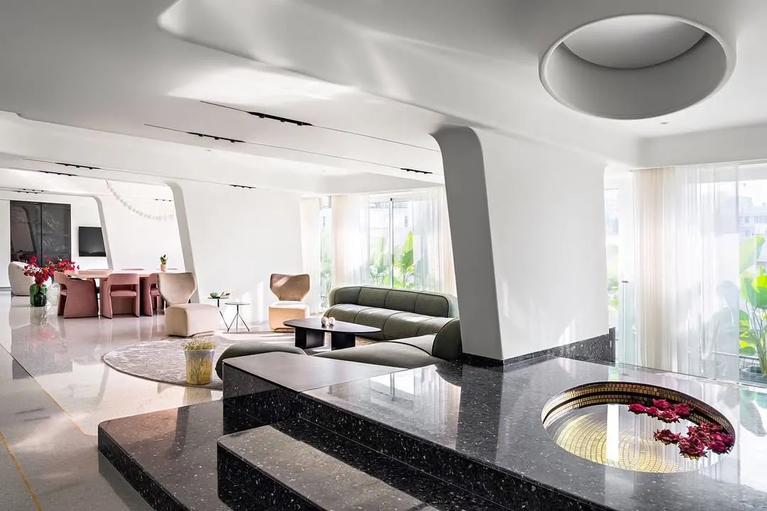 In Apartment 56, we explored the concept of fluid, gallery-like living. Inspired by land artists, we designed the interiors as a series of seamless, experiential spaces where sculptural columns, petal-like ceilings, and a reflective water feature merge art and architecture into a single, cohesive experience.