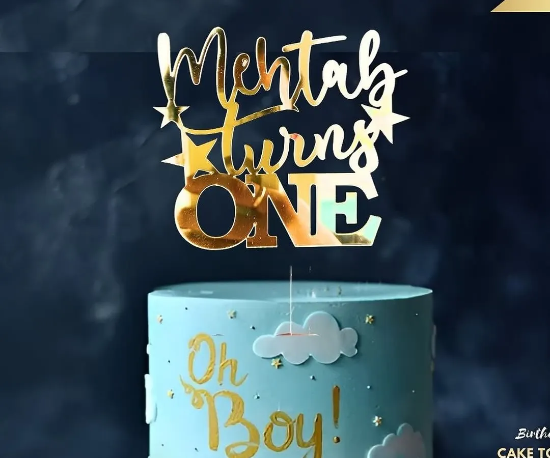 A first birthday is a huge milestone! This "Mehtab turns ONE" topper in a glossy gold finish looks fantastic on this "Oh Boy!" themed cake, showing how a custom piece can tie your whole party theme together.