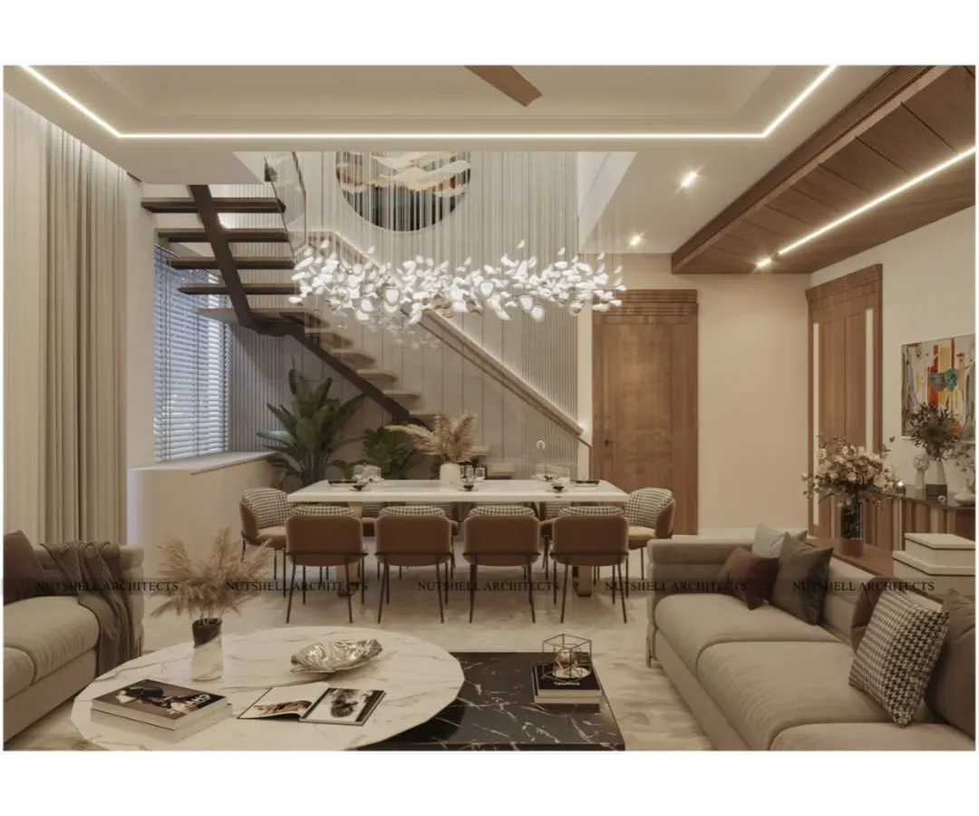 This is our vision of modern luxury. A double-height living and dining area where space and light converge, featuring a floating staircase and a sculptural chandelier. The cohesive palette of warm, natural materials creates an atmosphere that is both impressive and inviting.