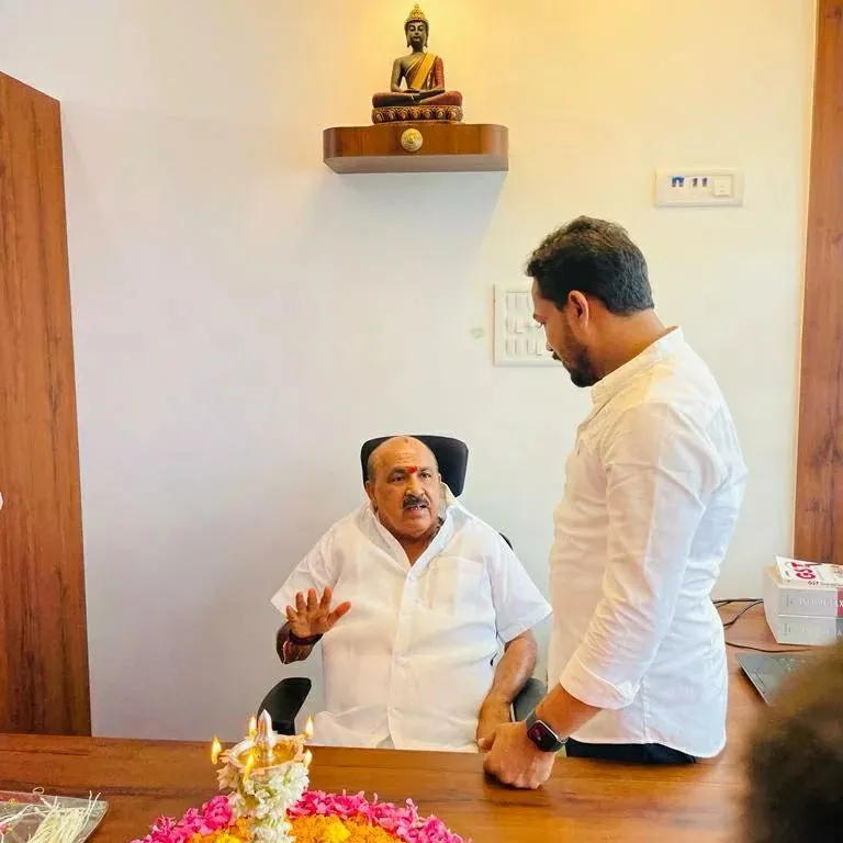 Building trust is at the core of my practice. Here, I am in discussion with Honourable MLA Sukumar Shetty during the inauguration of our new branch office in Uppunda. My goal is to provide reliable financial services that support our community's businesses.