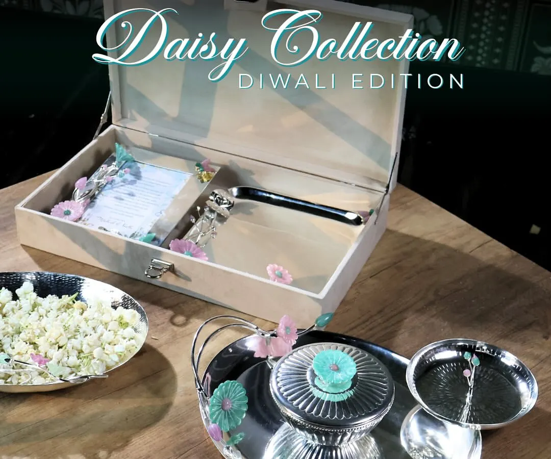 For me, Diwali is a festival of light and elegance. My Daisy Collection Diwali Edition is designed to capture that spirit. This hamper combines timeless design with festive joy, featuring silver-plated serveware and a custom keepsake box that will be cherished long after the sweets are gone.