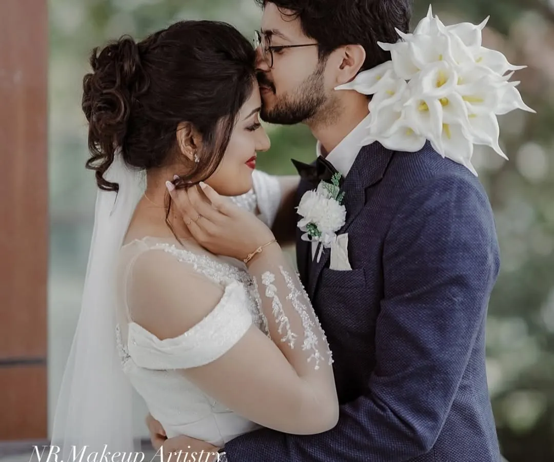 For this Christian wedding, we created a soft, romantic look with a classic updo and veil. The makeup was designed to be elegant, fresh, and last through the emotional moments of the day.