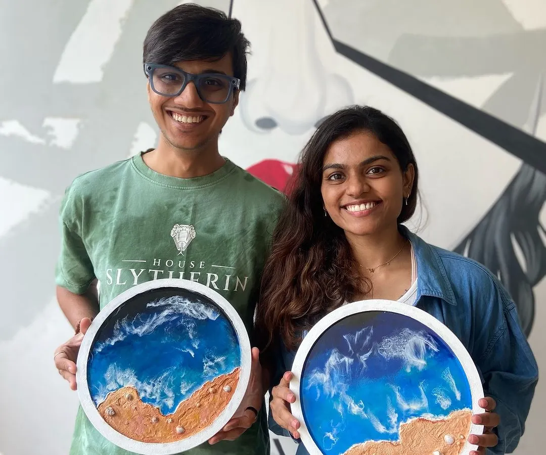 Here is a happy couple after finishing their very own resin beach art pieces. Our workshops are a perfect idea for a creative date night where you can relax, laugh, and take home a beautiful memory you made together.