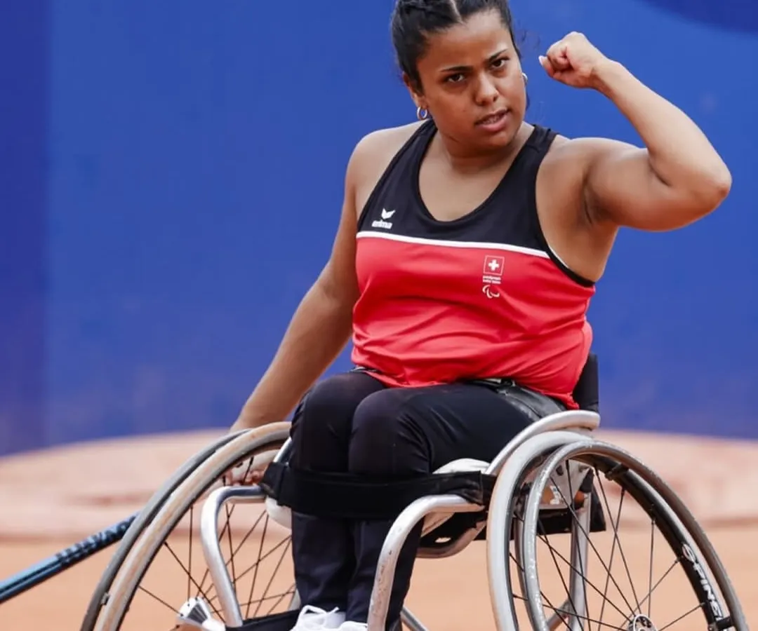 This is Nalani Buob, a world-ranked wheelchair tennis player, inspiring our athletes at a high-performance camp. We believe the court knows no boundaries, and her story proves that limitations only exist in the mind.