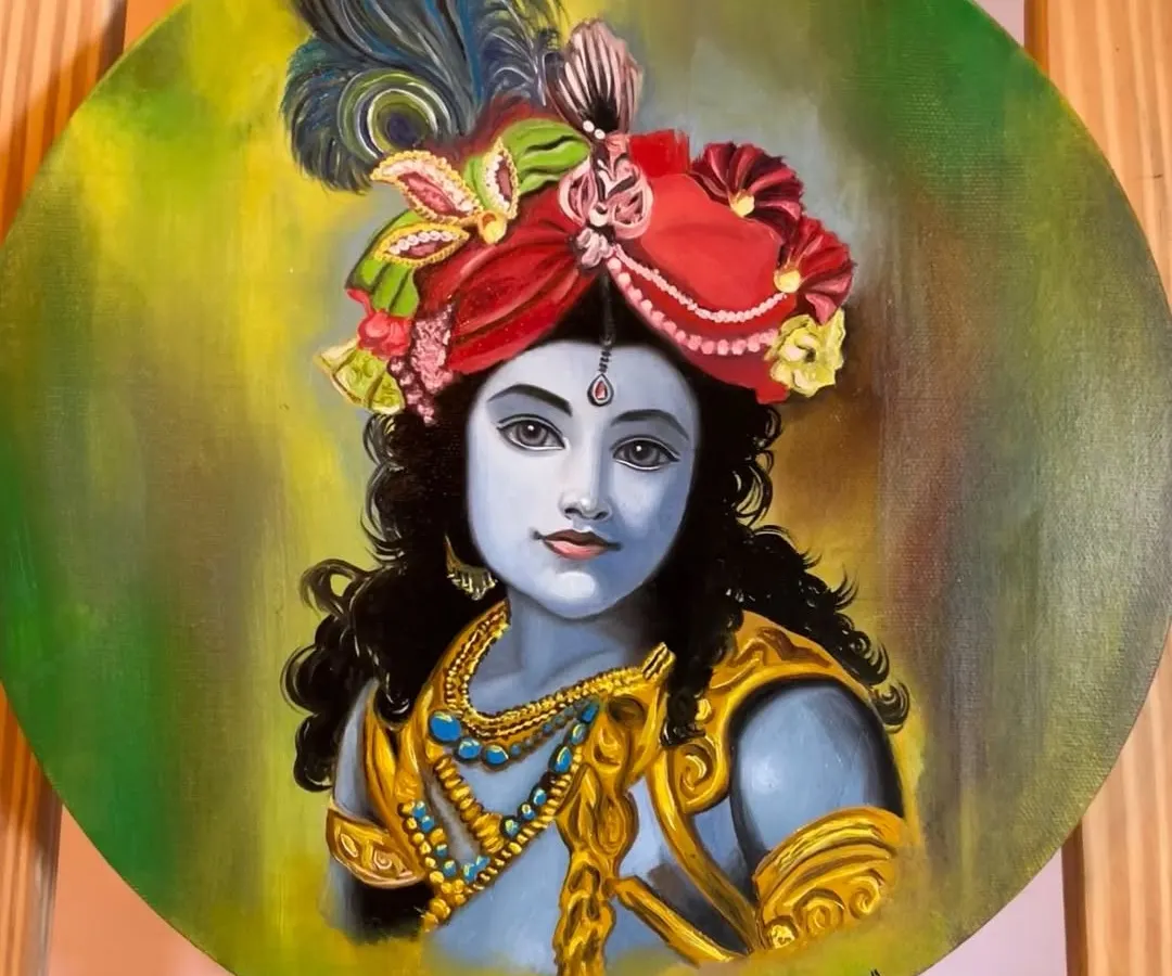 This is a finished oil painting of Lord Krishna on a circular canvas. I focused on creating a serene expression and vibrant colors in his attire, including the detailed red turban and peacock feather, set against a soft green and yellow background.