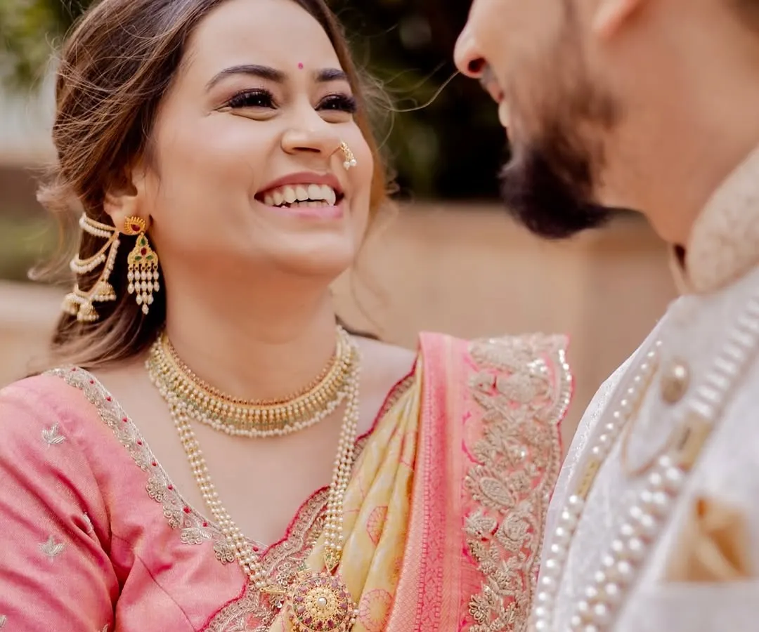 Capturing the pure joy of a bride on her wedding day. This candid moment showcases a soft, luminous glam I created for a beautiful Maharashtrian bride, letting her natural happiness shine through.