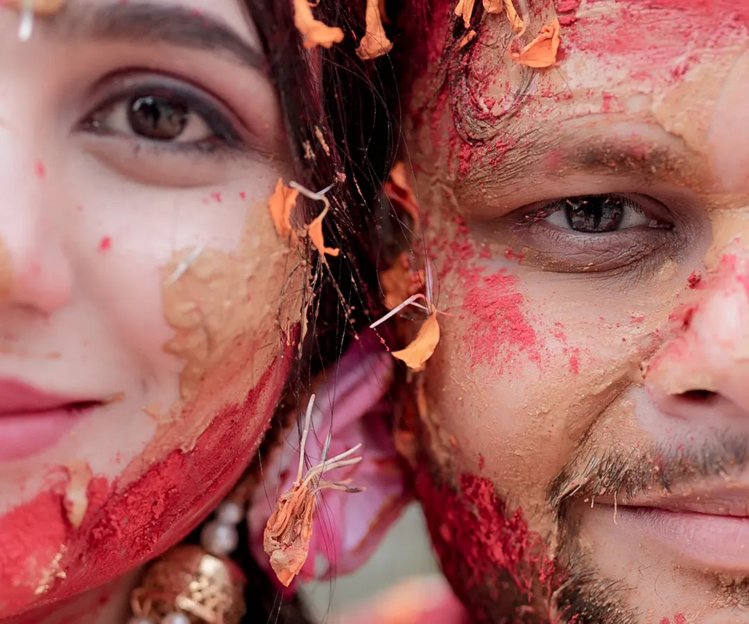 This is the raw, unfiltered joy I live to capture. A close-up from a Haldi ceremony, where the colors, textures, and genuine smiles tell a story of love and celebration that is beautifully messy and absolutely perfect.