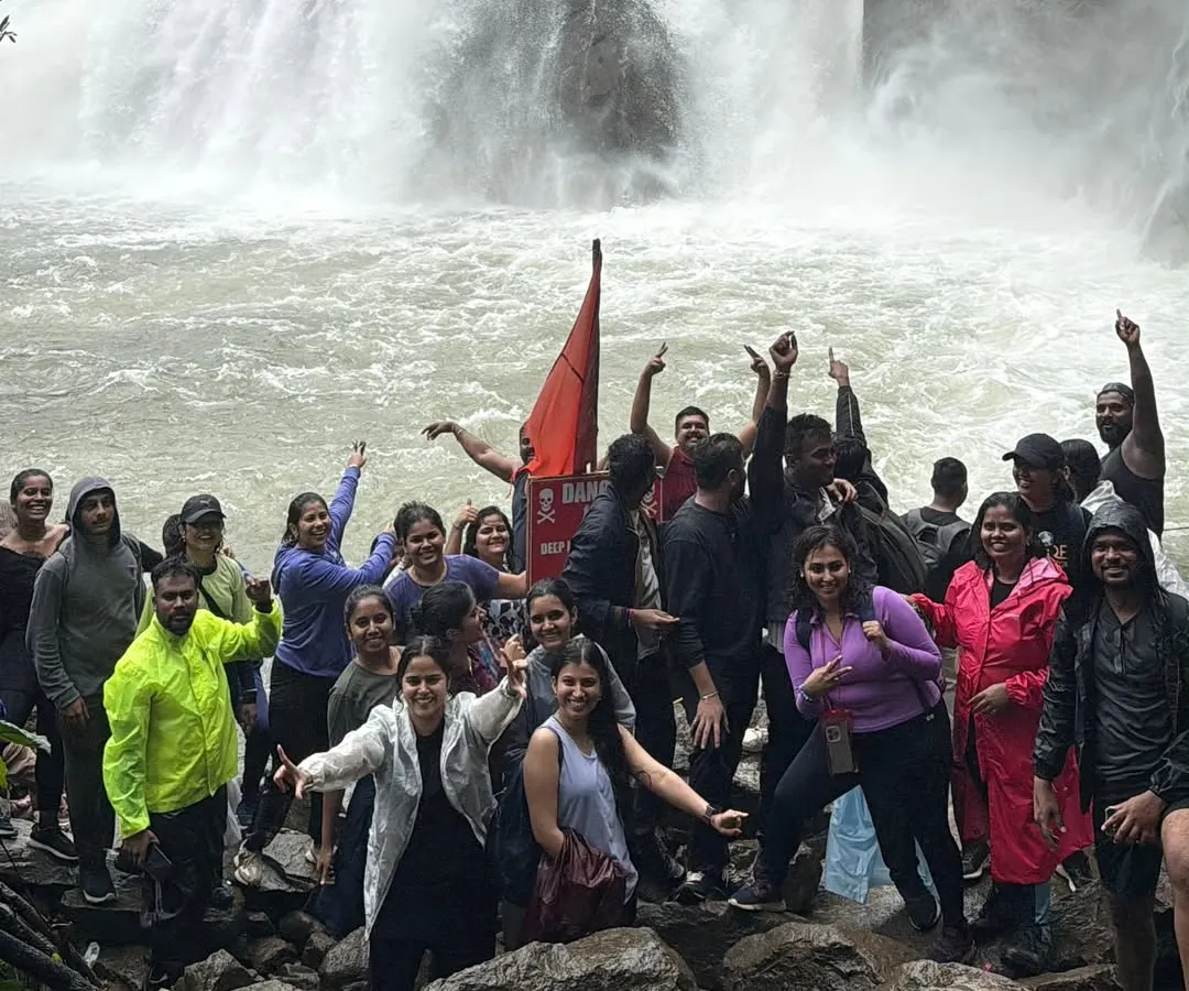 The pure joy of reaching Dudhsagar Falls. Our groups celebrate the power and beauty of this magnificent "Sea of Milk," a highlight of our monsoon trekking season in Goa.