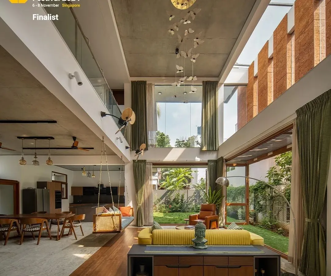 The heart of the 'House of Greens' is this double-height living space. By using large windows and an open layout, we dissolved the barrier between indoors and outdoors, creating a pavilion that is constantly in dialogue with the garden.