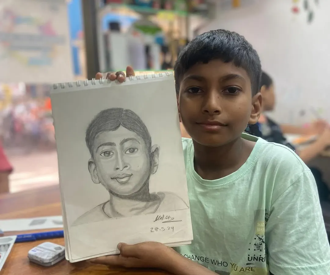 It's an incredible moment of pride for us and our student. This is the result of our portrait sketching course, where this talented 13 year old artist brought his own self portrait to life with pencil and paper.