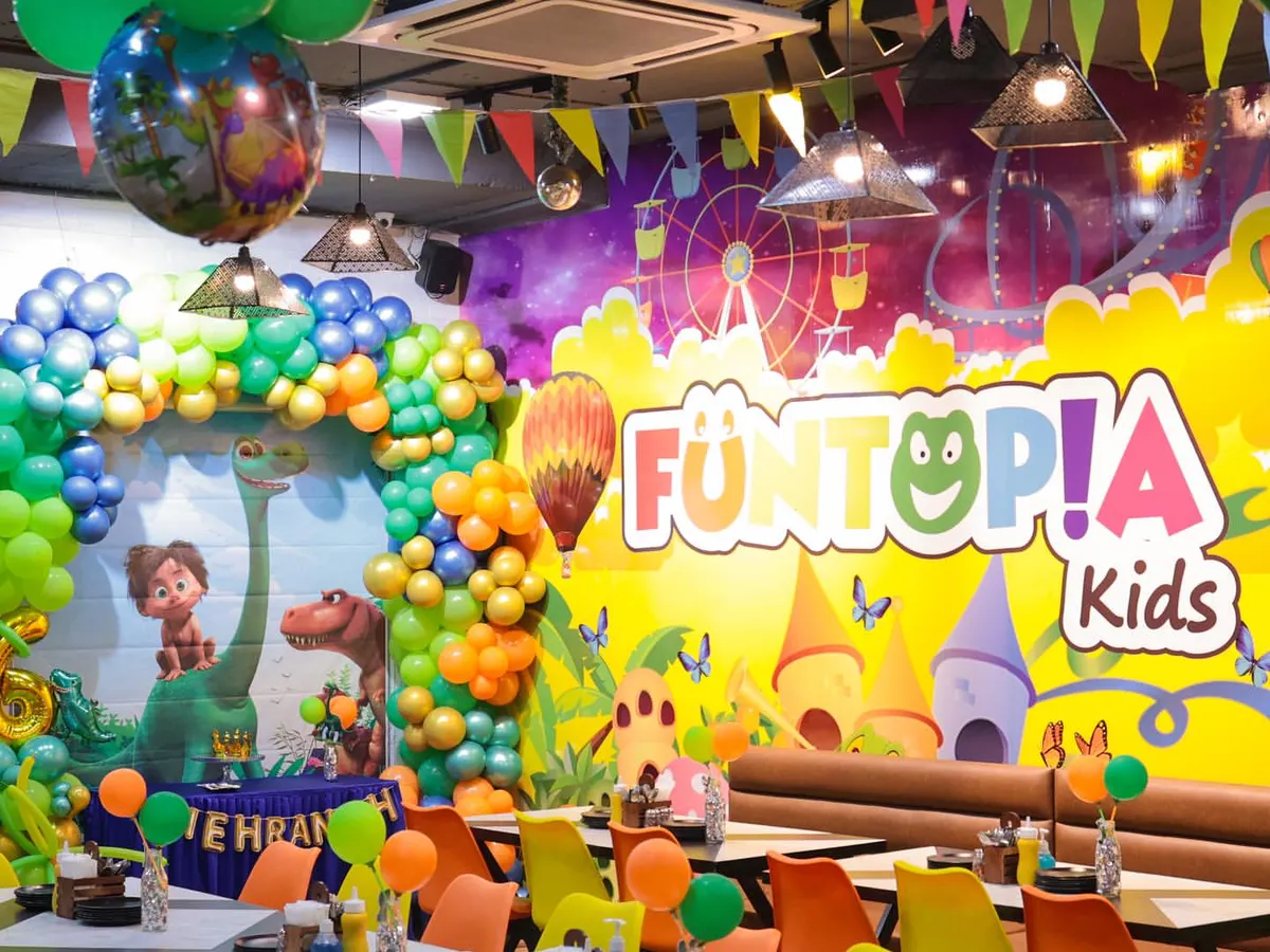Welcome to the Jurassic world! This is a glimpse of our fully decorated Eatopia Cafe for a dinosaur-themed birthday bash. We handle every detail, from the balloon arrangements to the table settings, creating an immersive experience.