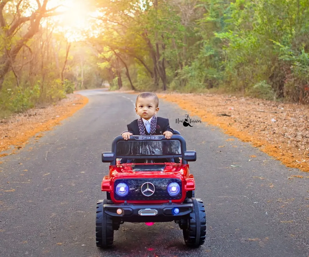 Celebrating a first birthday in style. This outdoor shoot was so much fun, with this little man confidently taking the wheel of his shiny red jeep. I love creating dynamic and playful pre birthday photoshoots that reflect your child's budding personality.