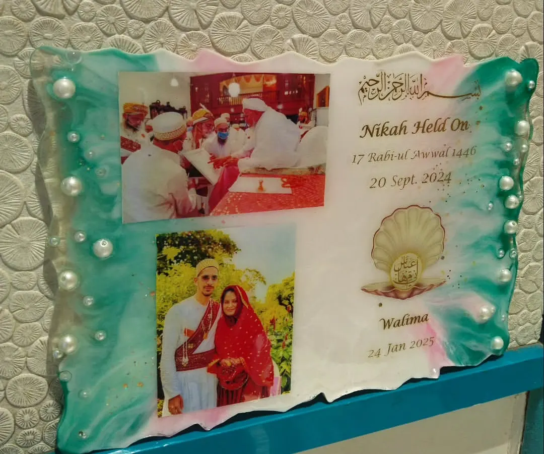 This is a resin wedding invitation I created. It's a unique way to announce your special day and give your guests a beautiful memento that won't get thrown away, featuring your photos, dates, and decorated with pearls and custom colors.