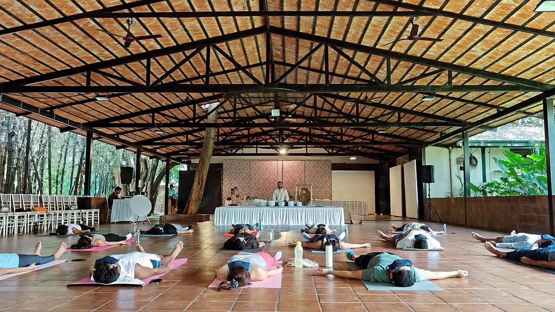 A moment of deep relaxation during a large group sound bath at a wellness retreat. My training equips you to hold space and facilitate these powerful healing experiences for groups of any size, creating a collective field of peace and tranquility.