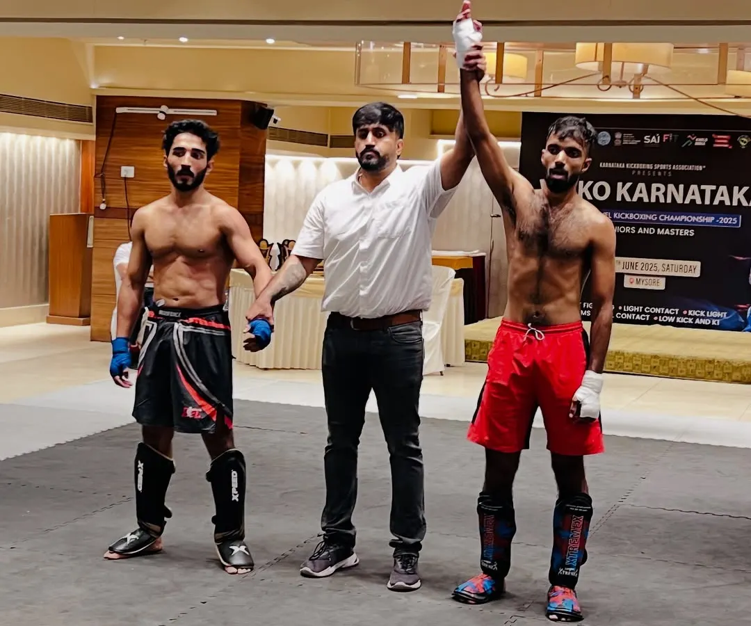 The result of dedication and hard work. Here, one of our UMC warriors has his hand raised in victory at the State Level Kickboxing Championship, a testament to our competition-focused training.