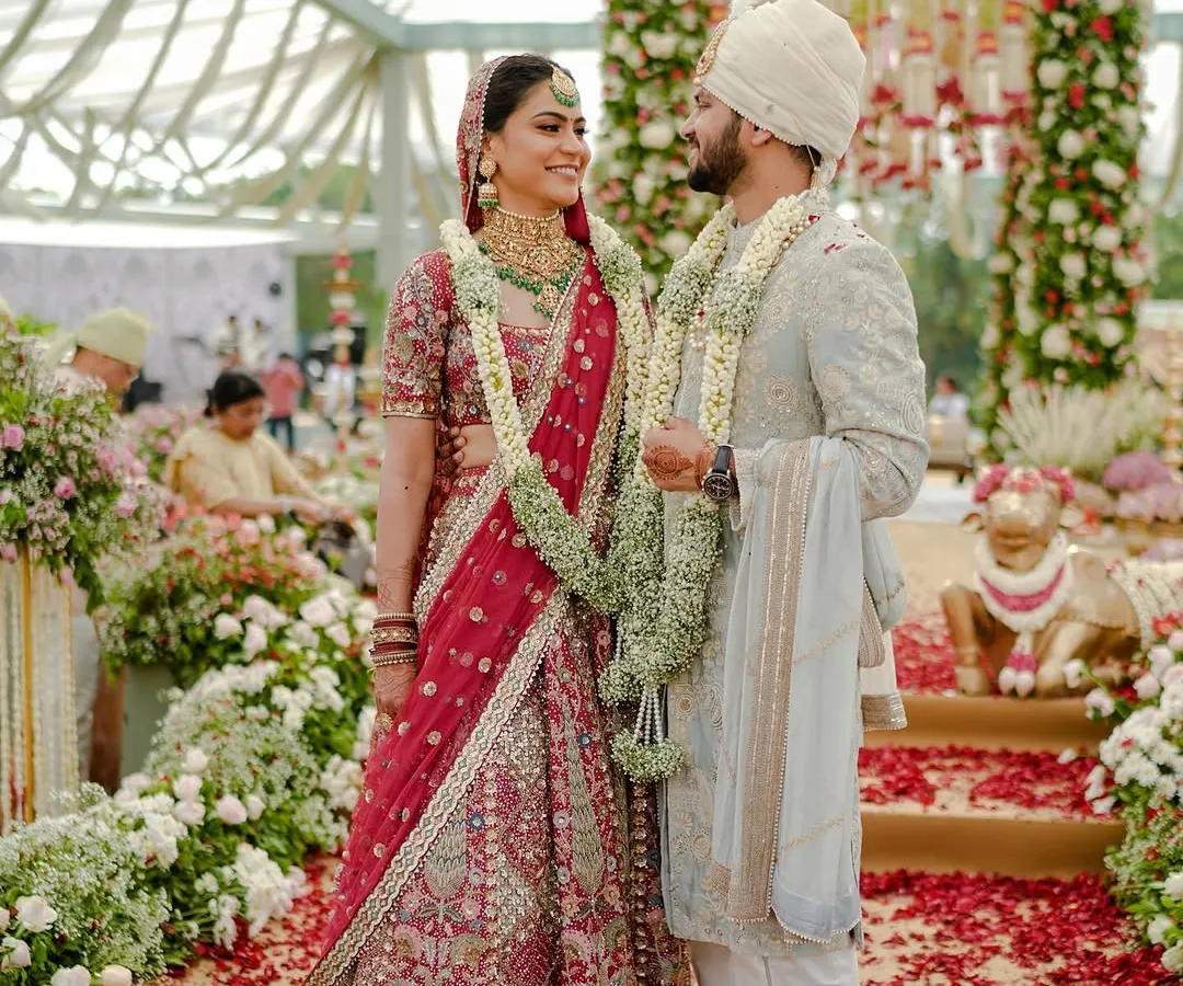 This is the moment that matters most. A happy couple shares a laugh on their wedding day, surrounded by a sea of flowers and joyous guests. I focus on creating a beautiful backdrop for these priceless, unscripted memories.