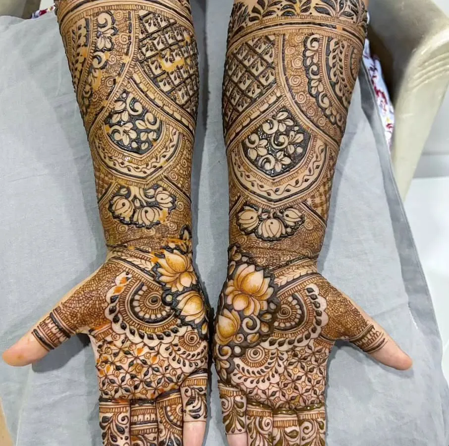 I love the challenge of a full, dense bridal design. This piece is packed with gorgeous floral and lotus motifs, covering the hands and extending up the forearms for a truly regal and elegant bridal look.
