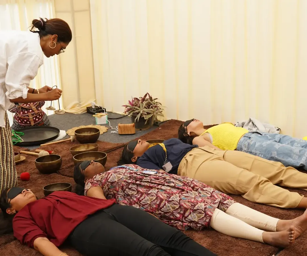 During my sound healing sessions, I help employees enter a state of deep relaxation. Here, a team at HCL experiences a restorative Savasana, allowing the therapeutic vibrations of the singing bowls to melt away stress.