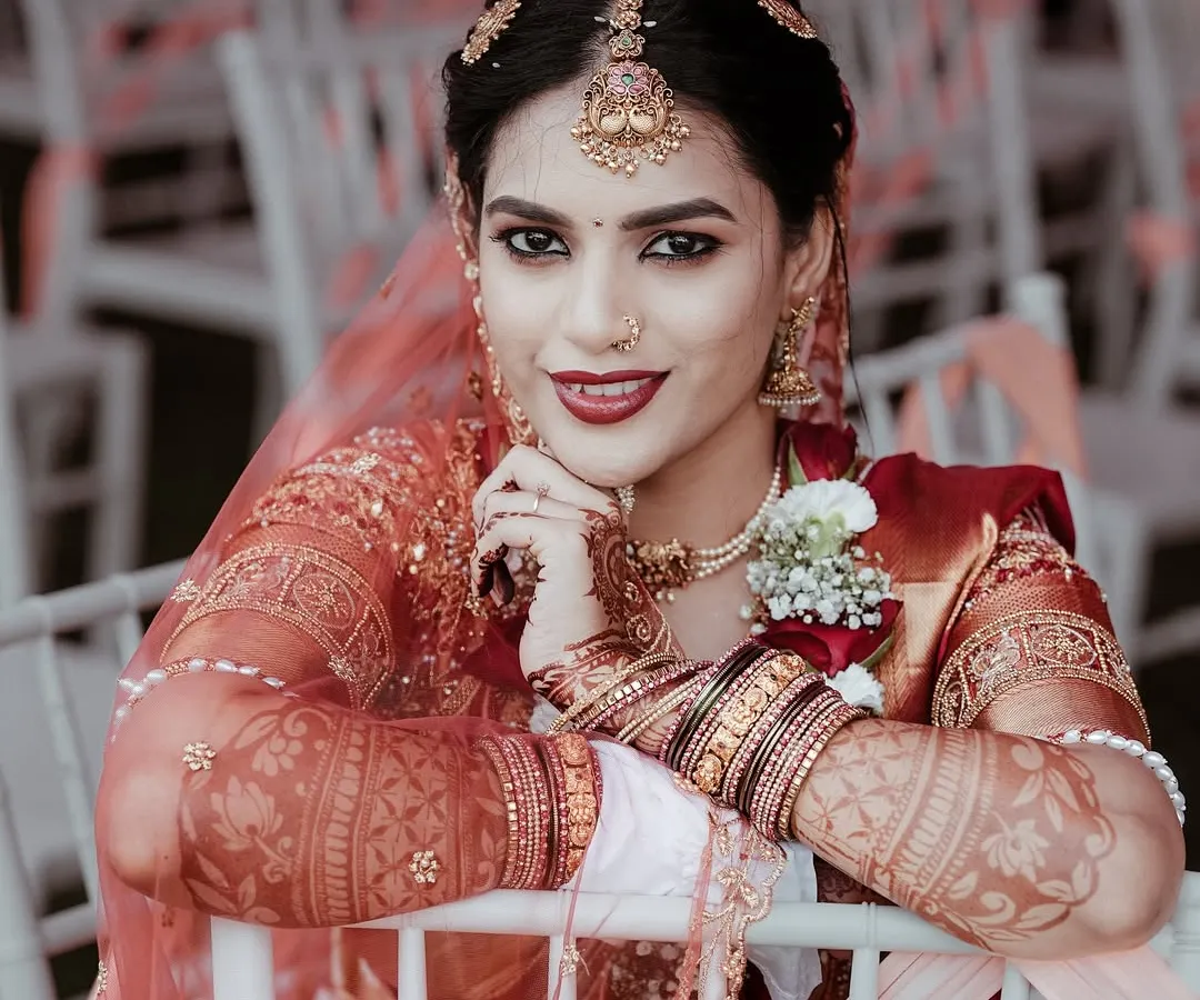 A quiet moment for the bride. I love taking these classic bridal portraits, focusing on the intricate details of the attire, the professional makeup, and that look of happy anticipation.