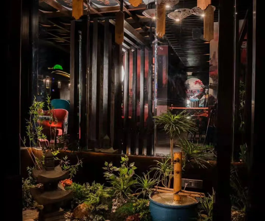 For this Japanese restaurant in Gurgaon, we designed and installed an indoor Zen garden to create a tranquil, immersive dining atmosphere. The space features a traditional stone lantern, a bamboo water feature, and carefully selected plants to complement the restaurant's theme.