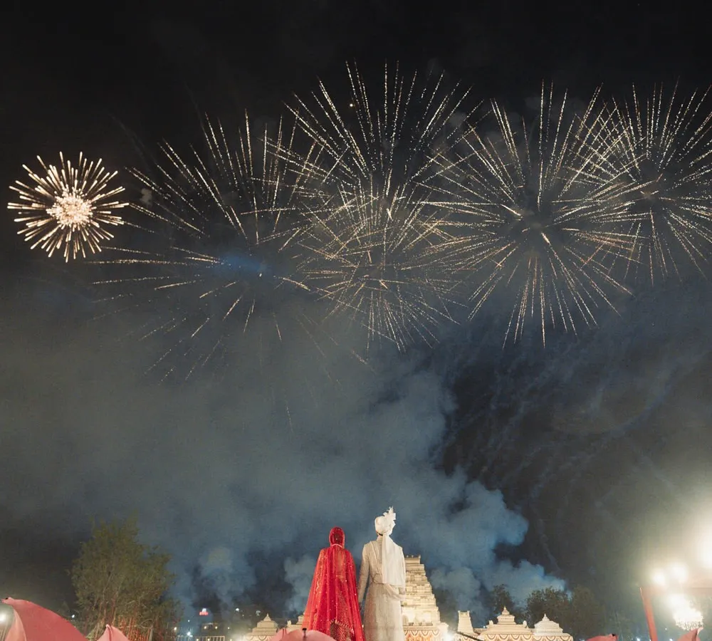 The varmala ceremony is a pinnacle moment, and I make sure it feels that way. Here, a sky full of fireworks was choreographed to erupt the second the couple exchanged garlands, creating a breathtaking memory against the palace backdrop.