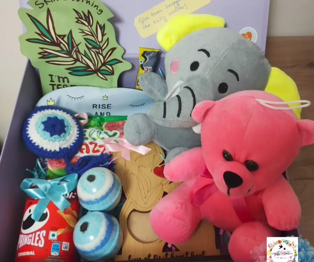 I designed this baby shower hamper to pamper the mom-to-be. It's packed with skin-soothing essentials, cute plush toys for the baby, snacks for her cravings, and personal touches like a crocheted evil eye charm for good luck.