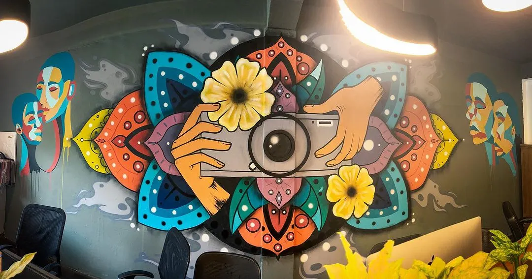 For this photography studio in South Delhi, I created a custom mural blending a camera with intricate mandala and floral designs. This piece is a great example of how I translate a brand's creative identity into a unique visual story.