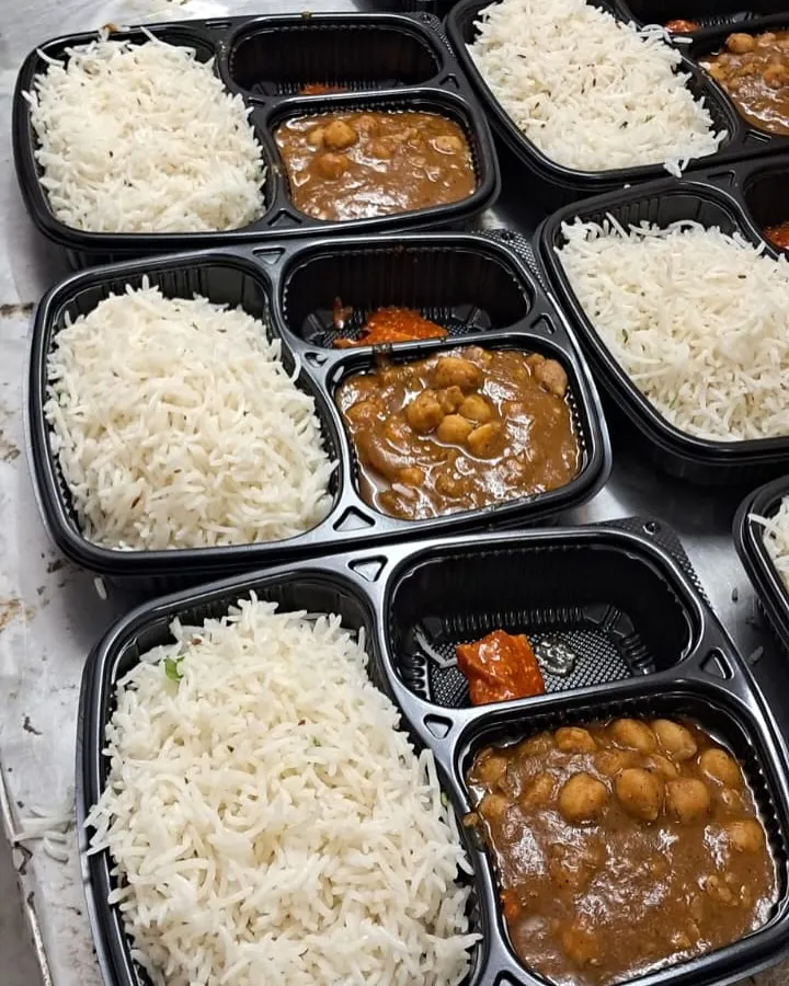 A close up of our popular Jeera Rice and Chole Masala meal boxes. We ensure every meal is packed fresh, hot, and hygienically, perfect for corporate lunches or institutional catering.