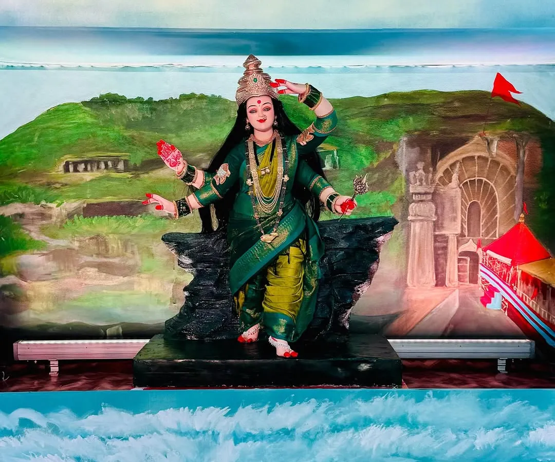 This is a full view of my Aagri Koli themed Navratri installation. My goal was to wrap the entire room in art, from the hand-painted waves on the floor to the depiction of Ekvira Mauli's temple in the background, celebrating my cultural roots.