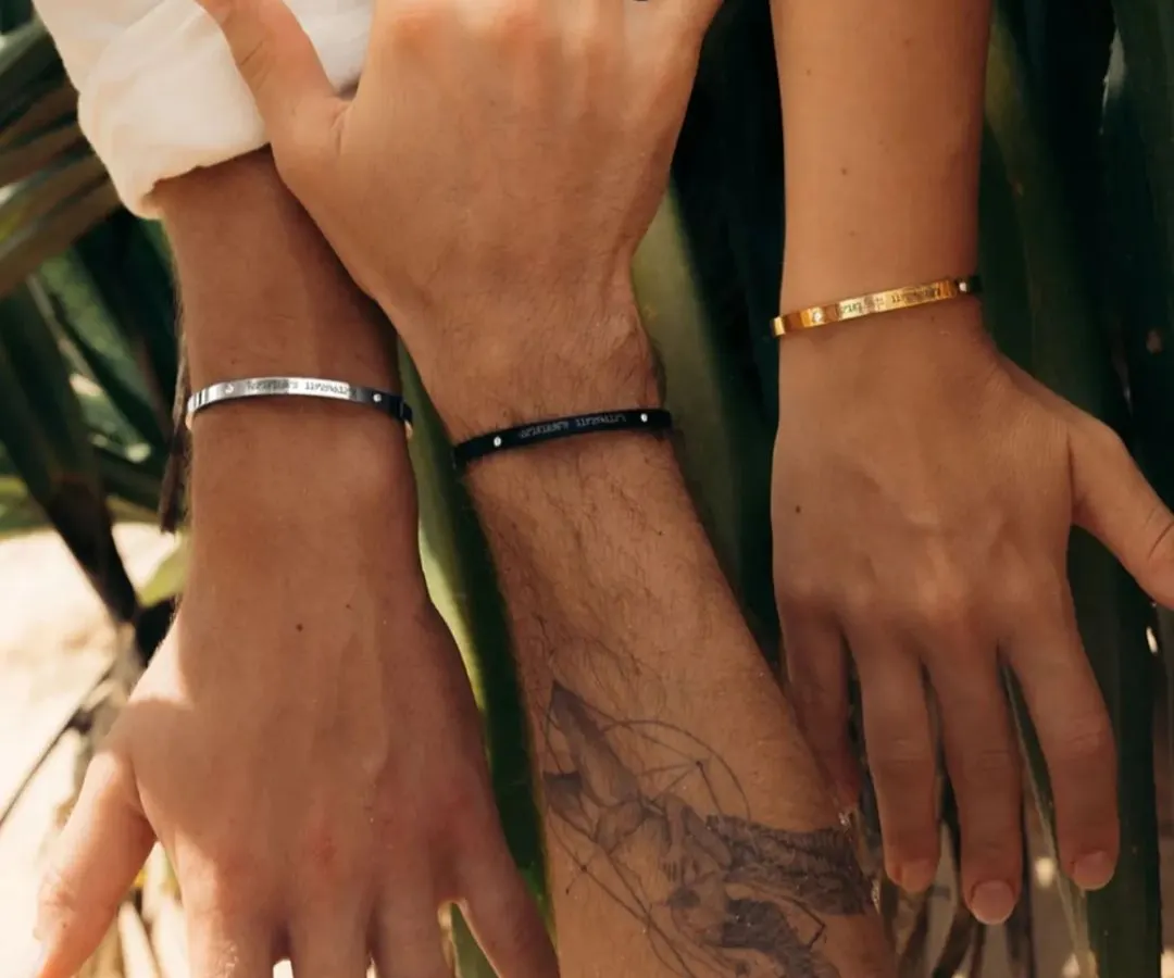 Showcasing the versatility of my bracelets for everyone. Here you can see three different wrists wearing our adjustable cuffs in Silver, Black, and Gold finishes, proving they are truly unisex.