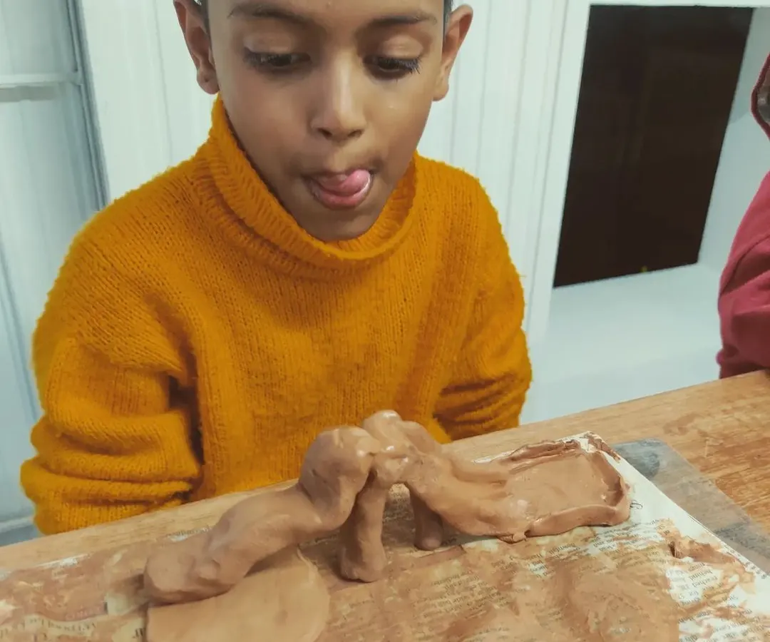 The pure focus and fun of a child lost in creation. My 'Muddy Puddles' club is all about letting imaginations run wild, getting hands dirty, and building confidence one clay dinosaur or magical creature at a time.