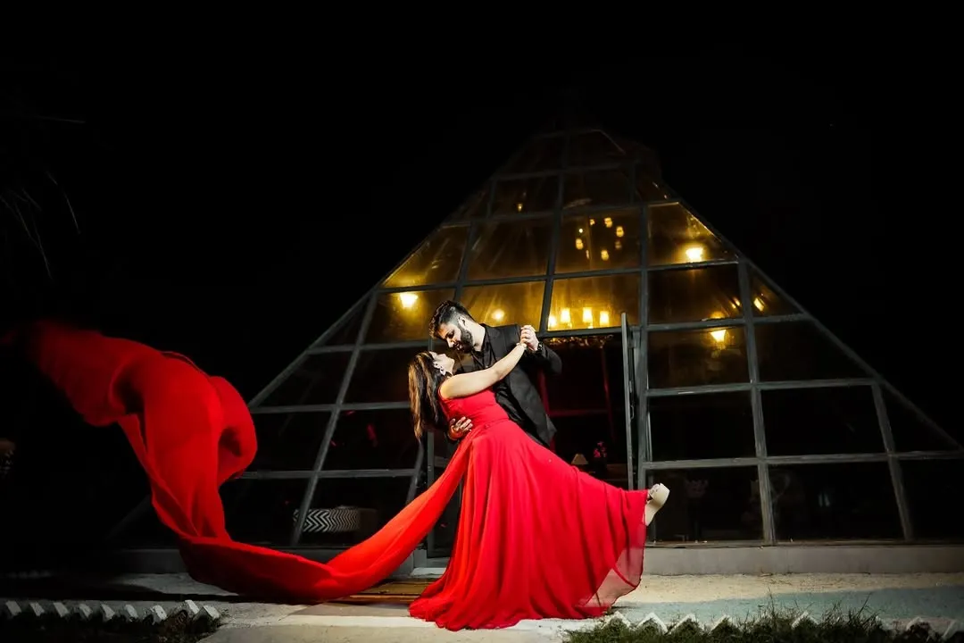 For couples who want something bold and cinematic, I create dramatic pre-wedding portraits like this. Using creative lighting and dynamic elements like the flowing red gown, we can produce truly unforgettable images before your big day.