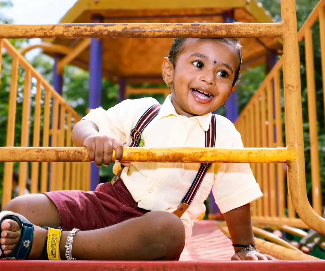 The pure, unfiltered joy of childhood is what I aim for in my kids' photography sessions. This little guy's laughter at the park made for a perfect, energetic shot that the family will cherish forever.