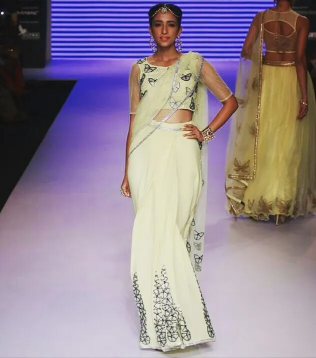 For the runway, I love creating looks that are both modern and timeless. This lime-yellow saree, detailed with butterfly motifs and Swarovski crystals, was styled for a major fashion show to highlight delicate craftsmanship with a contemporary edge.