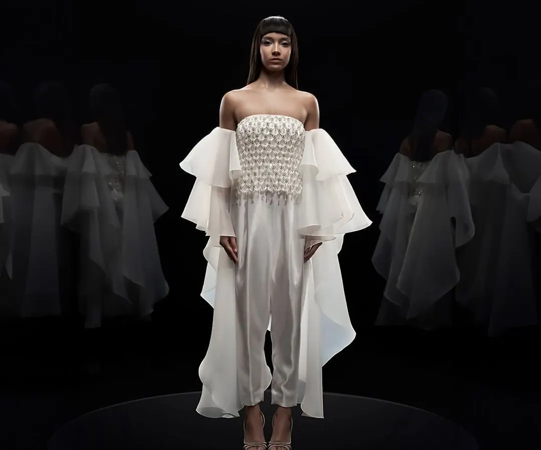 Our studio is equipped for high-end couture photography, where precise lighting control is key. For this Alpana Neeraj campaign, a pure black background and dramatic lighting were used to sculpt the form and highlight the intricate details of the garment.