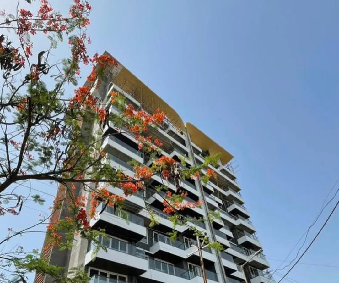 The facade of the 'Nanda Hi-Life' residential tower showcases our love for creating modern art through architecture. We used a rhythmic composition of glass and solid mass with brick textures to give this ultra-luxurious building its distinctive, plush look.